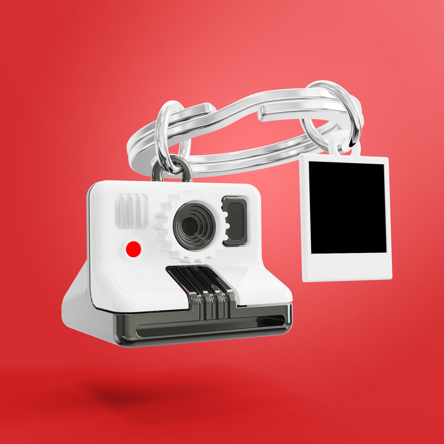 Metalmorphose® Sleutelhanger Instant Camera – Wit/Zwart – Camera Sleutelhanger - met rode achtergrond